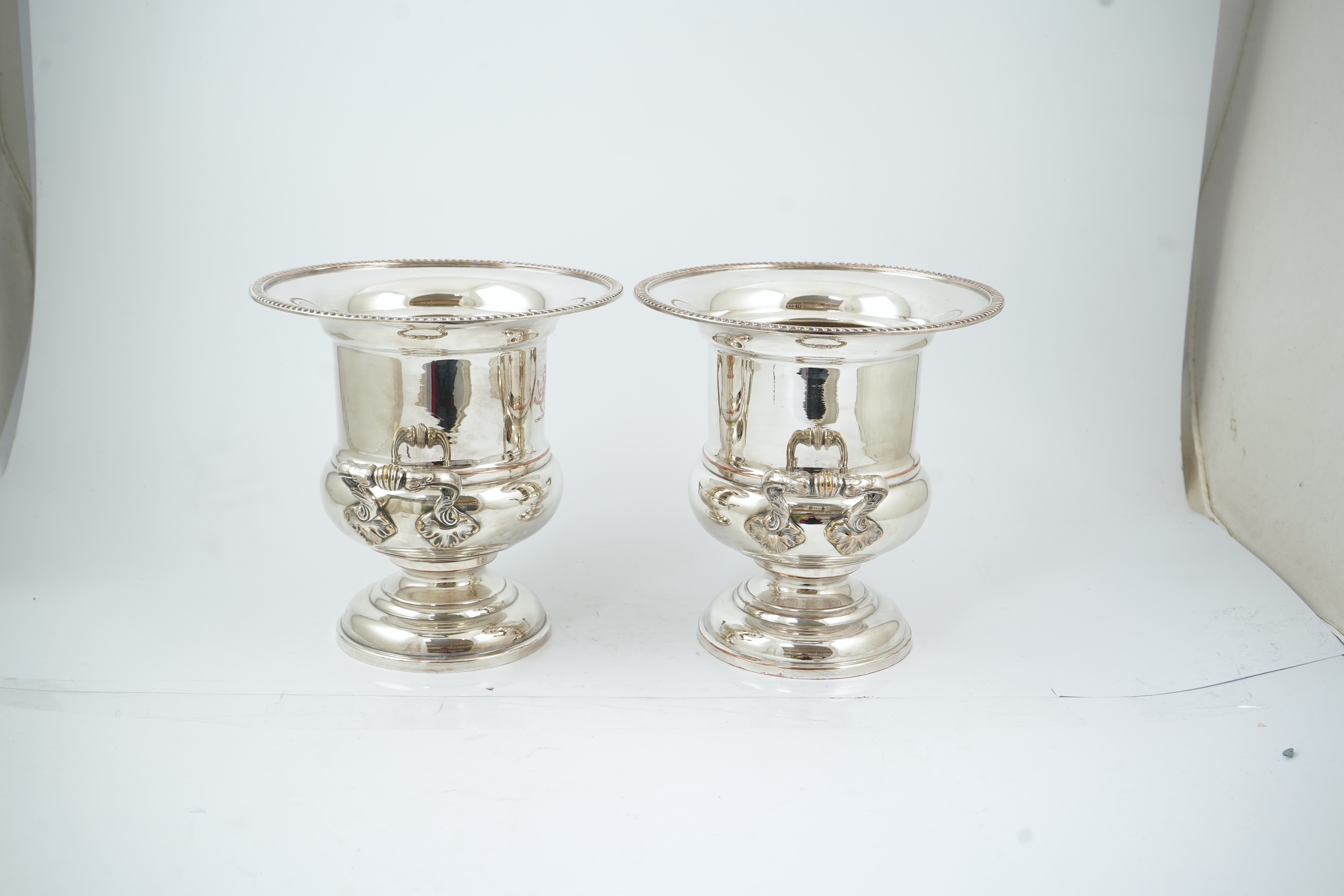 A pair of late 19th/early 20th century silver plated two handled campana shaped wine coolers, makers, FH